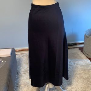 Polyester silk feel navy midi length skirt with stretch waste